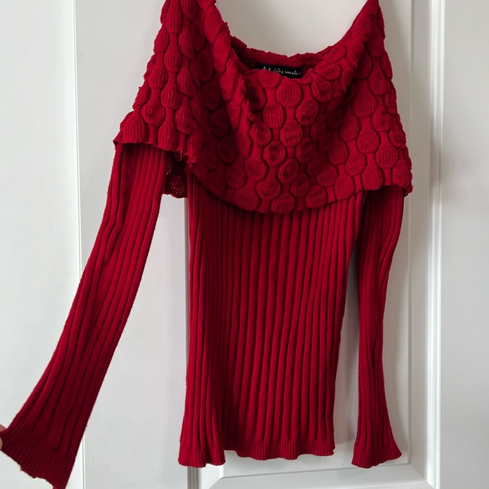 Red sweater can be worn on or off shoulder size M.